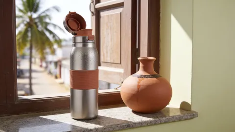 End frame: the Thanni bottle beside the pot